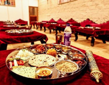 Experience a Sit-Down Rajasthani Thali with a wide range of authentic Rajasthani cuisines served