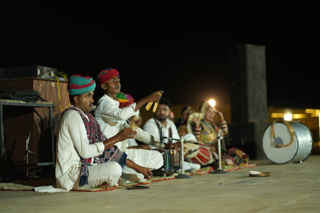 Rajasthani folk musicians performing cultural night in desert resort