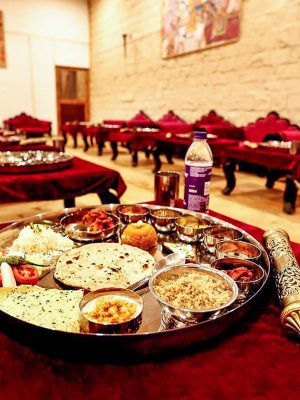 Experience a Sit-Down Rajasthani Thali with a wide range of authentic Rajasthani cuisines served
